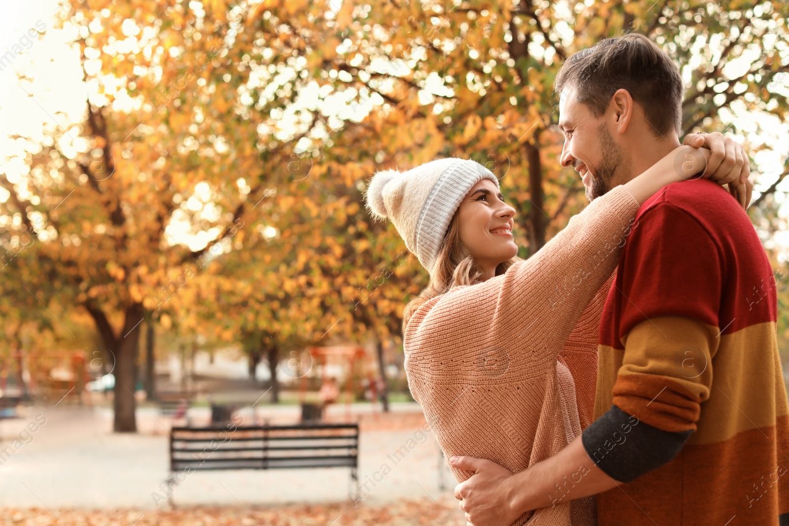 Photo of Lovely couple spending time together in park. Autumn walk