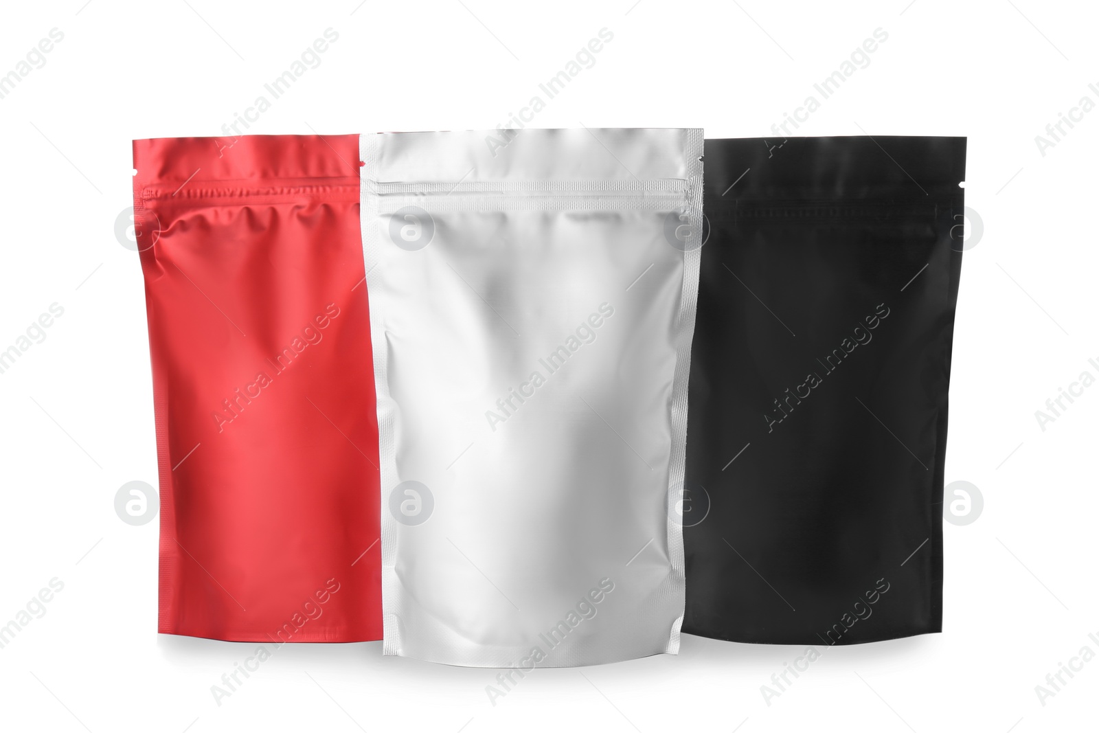 Photo of Different blank foil packages isolated on white