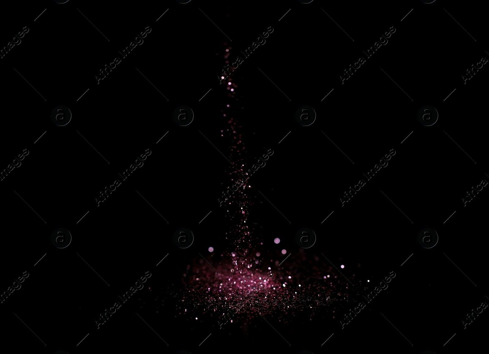 Photo of Sprinkling rose glitter on black background, bokeh effect