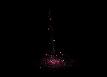 Photo of Sprinkling rose glitter on black background, bokeh effect