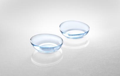 Photo of Contact lenses on light background