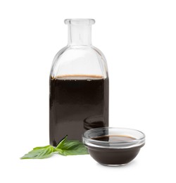 Photo of Organic balsamic vinegar and basil isolated on white