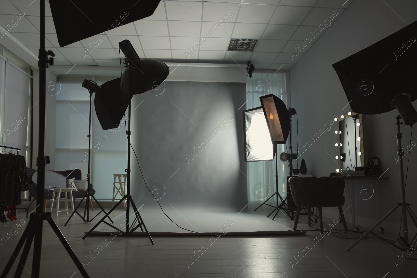 Photo of Interior of modern photo studio with professional equipment