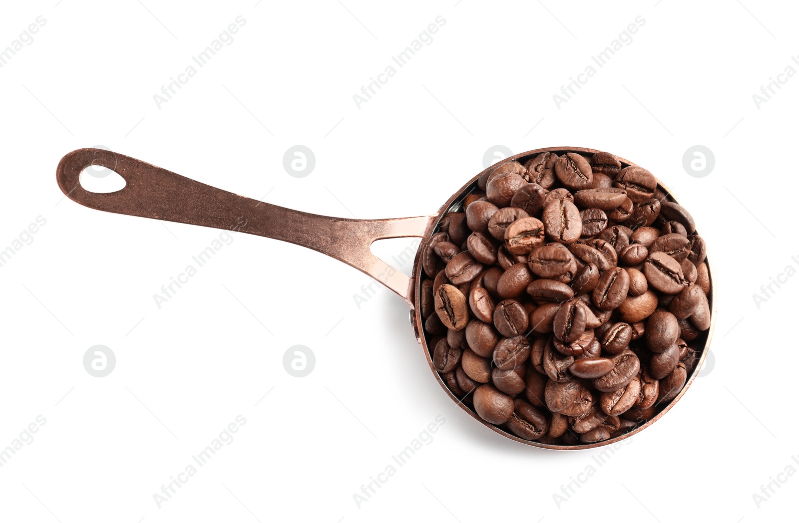 Photo of Saucepan with roasted coffee beans on white background, top view