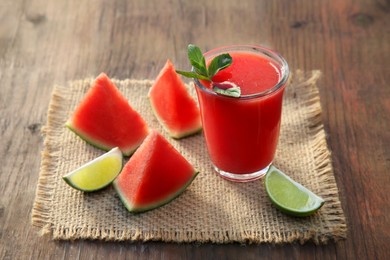 Delicious watermelon drink and fresh fruits on wooden table