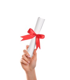 Photo of Student holding rolled diploma with red ribbon on white background, closeup
