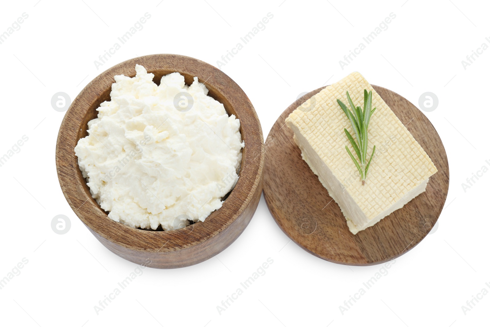 Photo of Different types of delicious tofu cheese with rosemary on white background, above view