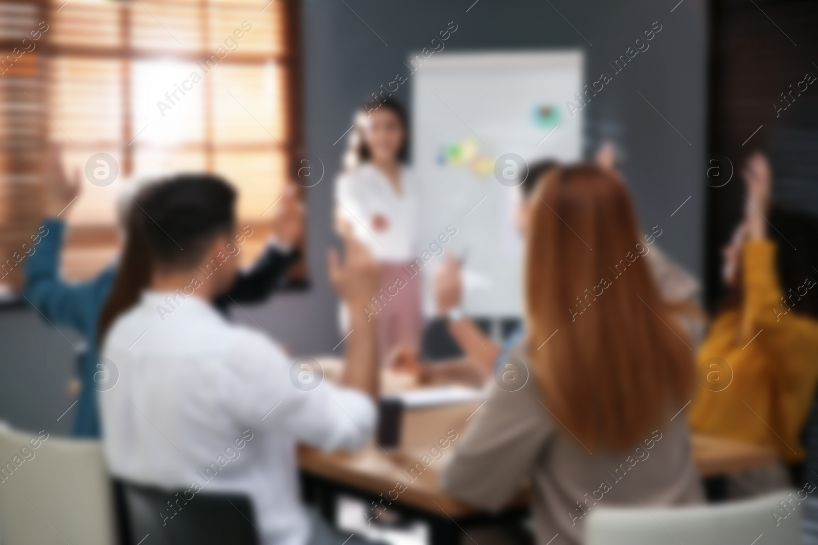 Image of Blurred view of seminar in modern office