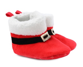 Photo of Cute small booties on white background. Christmas baby clothes