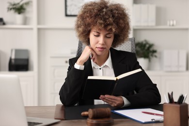 Notary with notebook at workplace in office