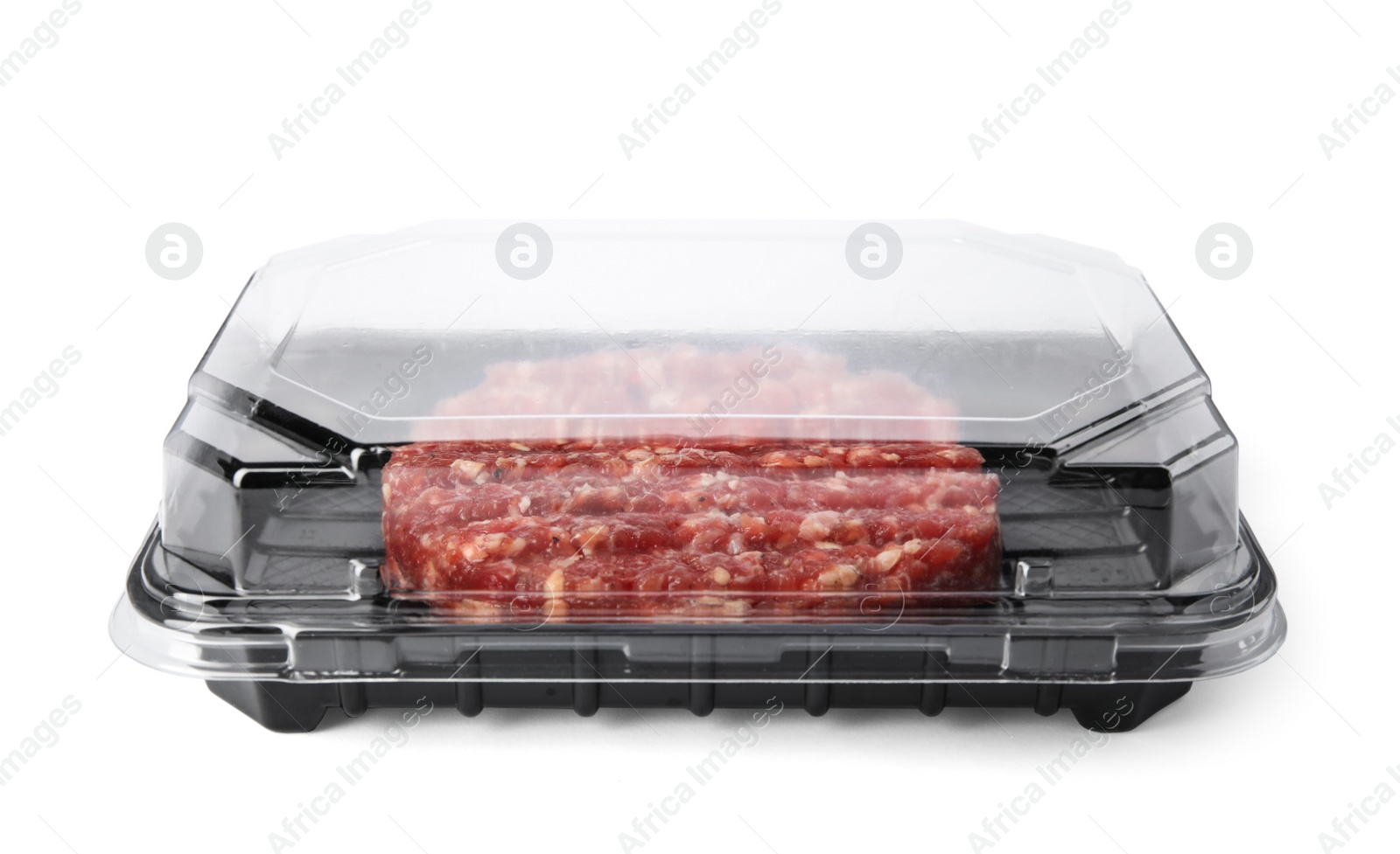 Photo of Plastic container with raw meat cutlet for burger isolated on white