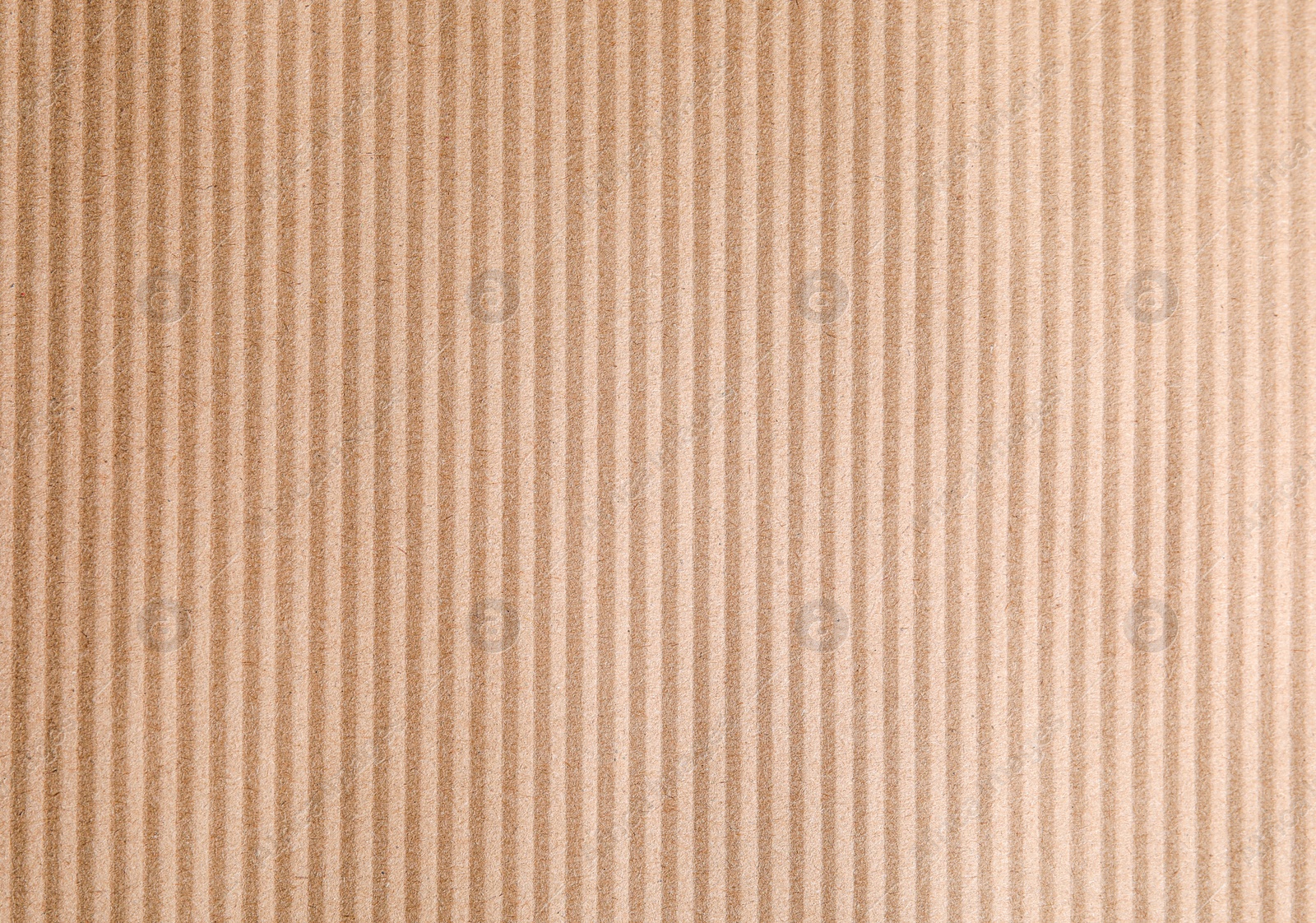 Photo of Brown corrugated sheet of cardboard as background, top view