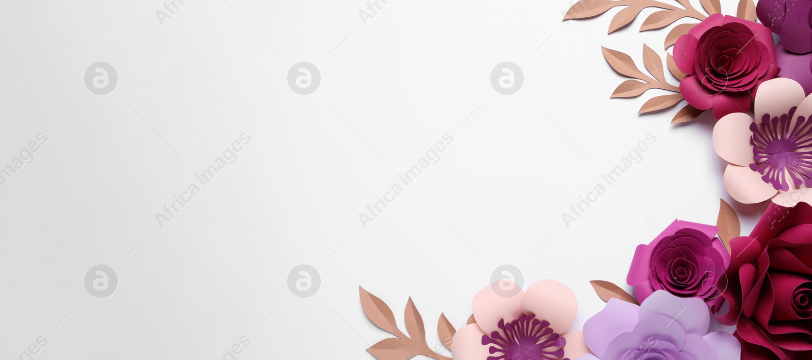 Photo of Different beautiful flowers and branches made of paper on white background, top view