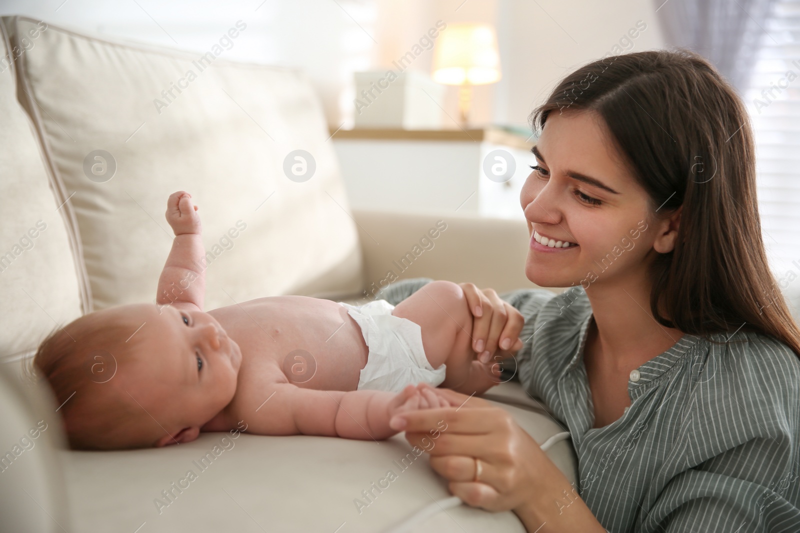 Photo of Mother with her newborn baby at home