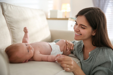 Photo of Mother with her newborn baby at home