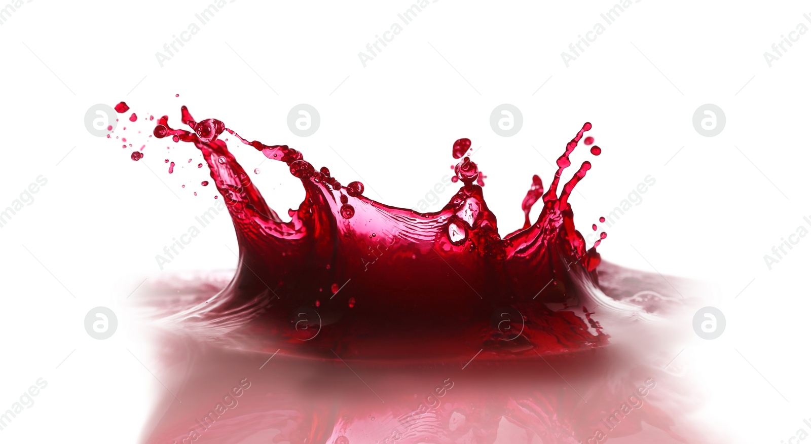 Photo of Splashing tasty fresh juice on white background
