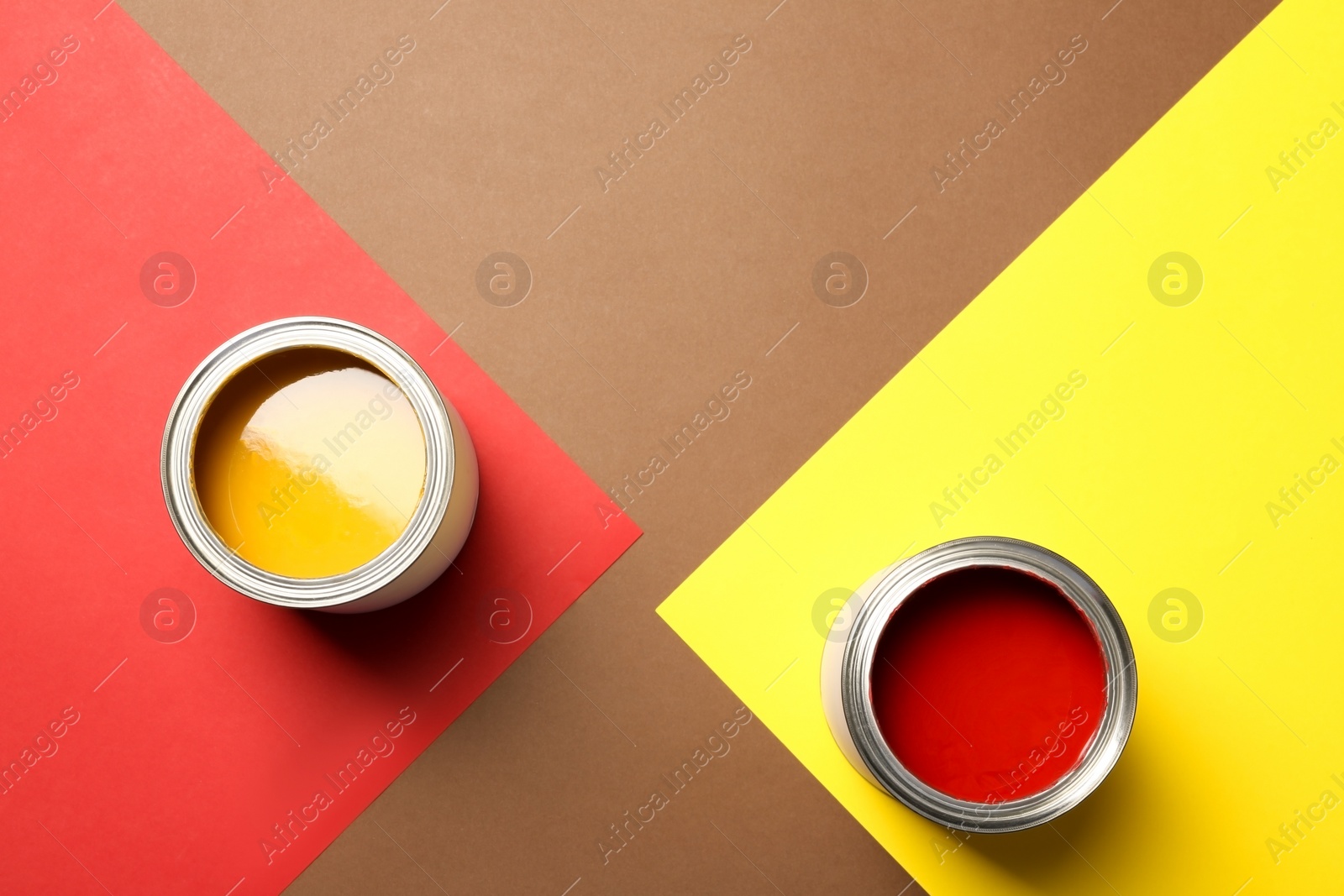 Photo of Flat lay composition with paint cans and space for text on color background