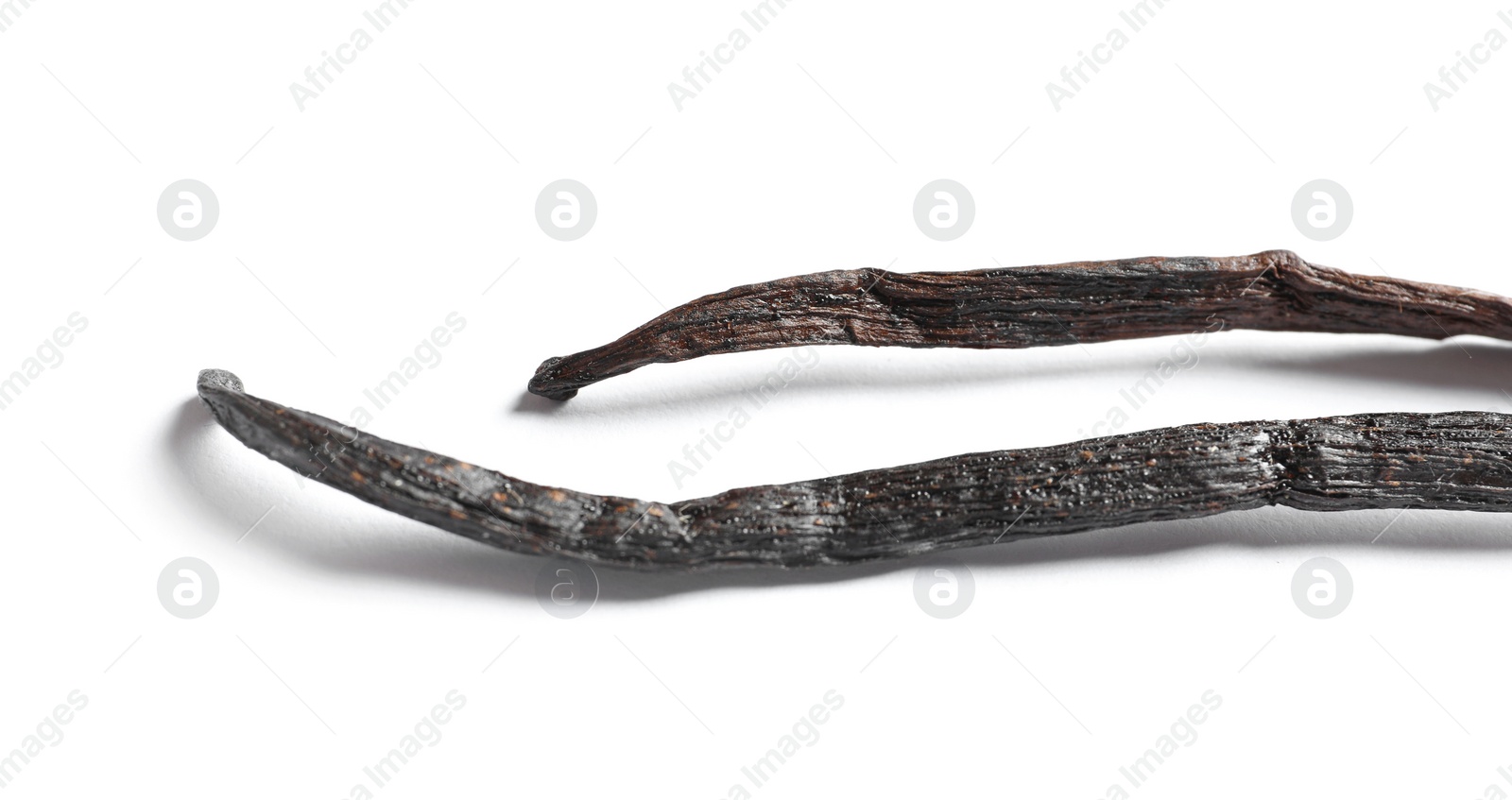 Photo of Aromatic vanilla sticks on white background