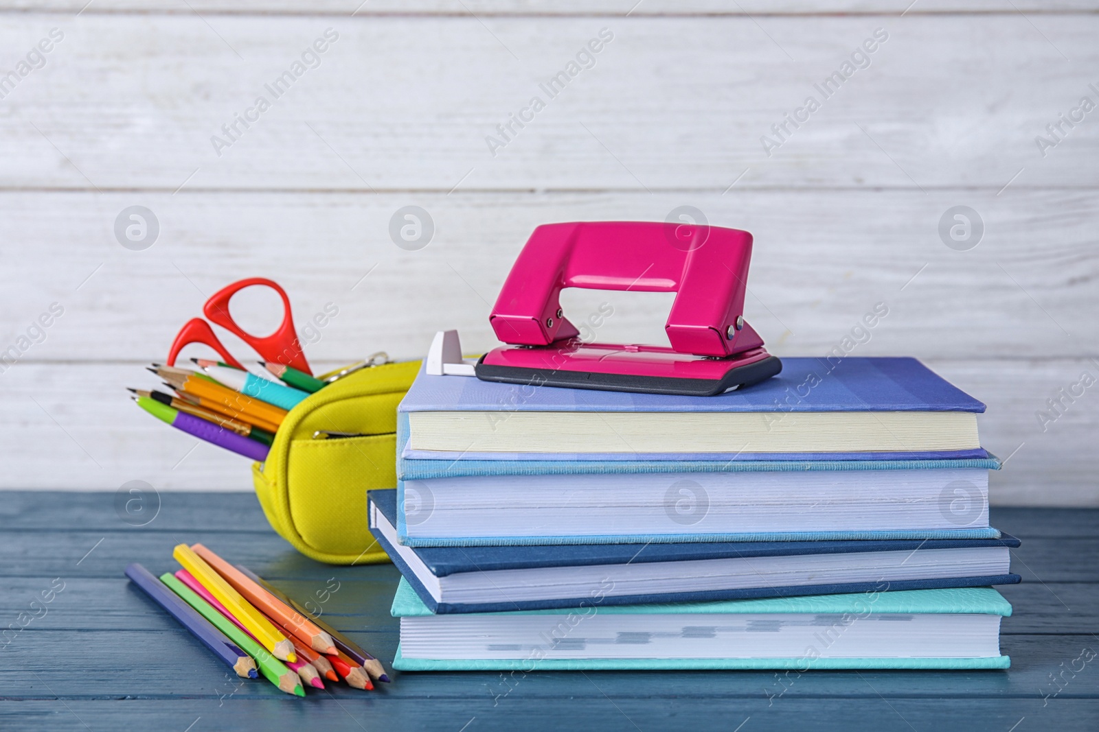 Photo of Different school stationery on table against light background