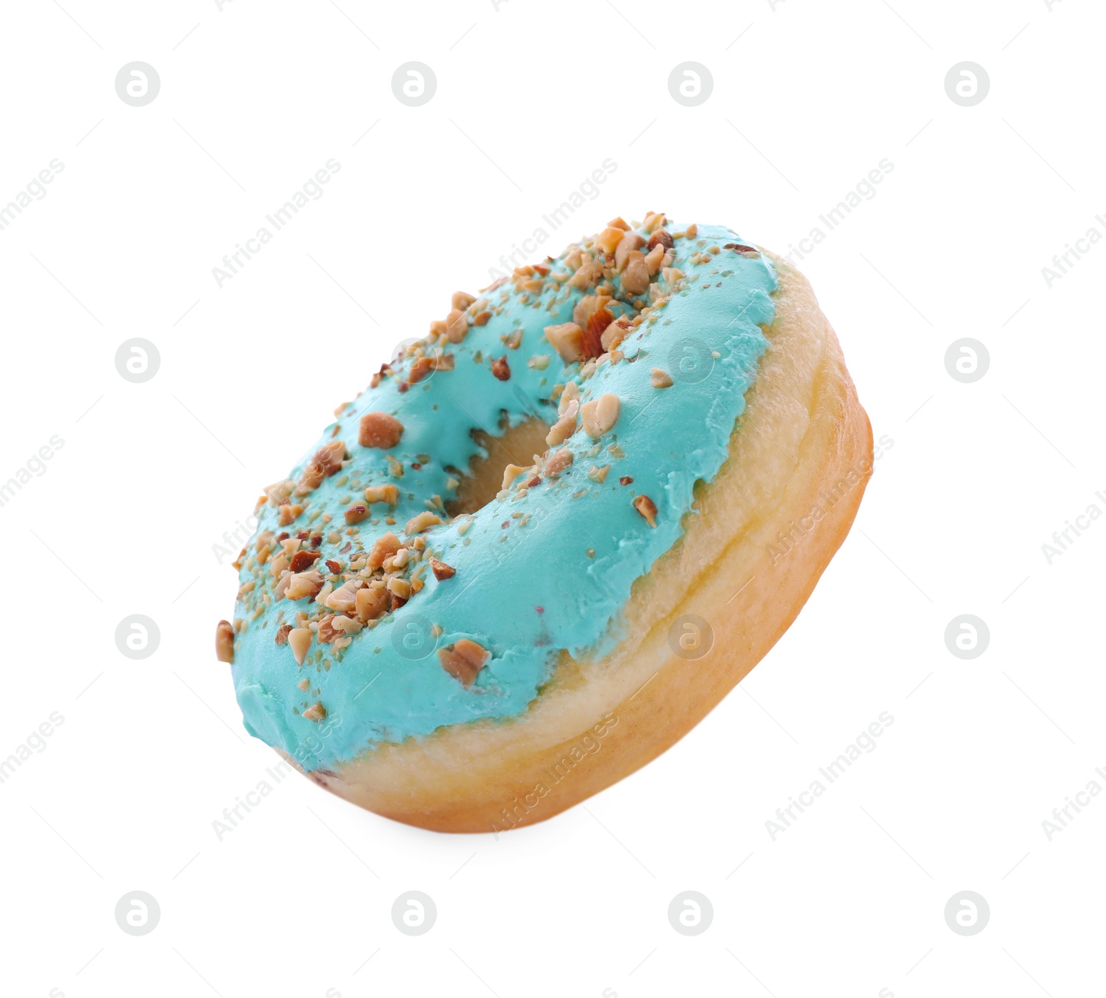 Photo of Tasty glazed donut decorated with nuts on white background