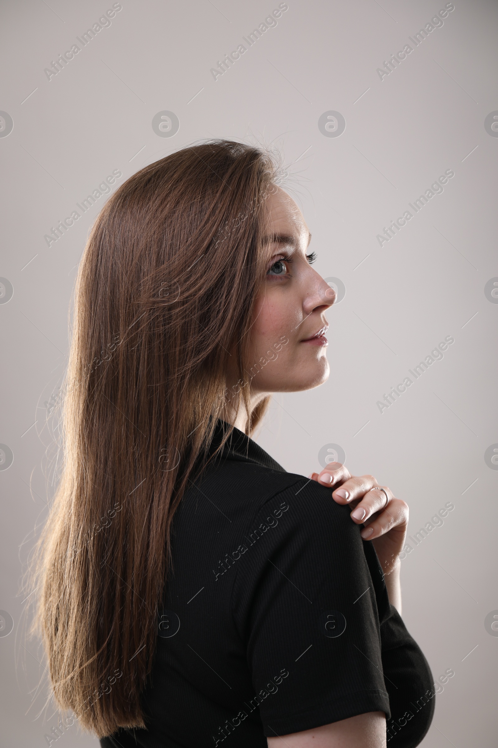 Photo of Portrait of beautiful woman on gray background