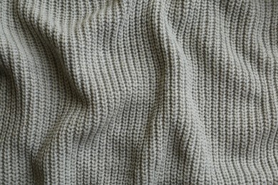 Photo of Beautiful grey knitted fabric as background, top view