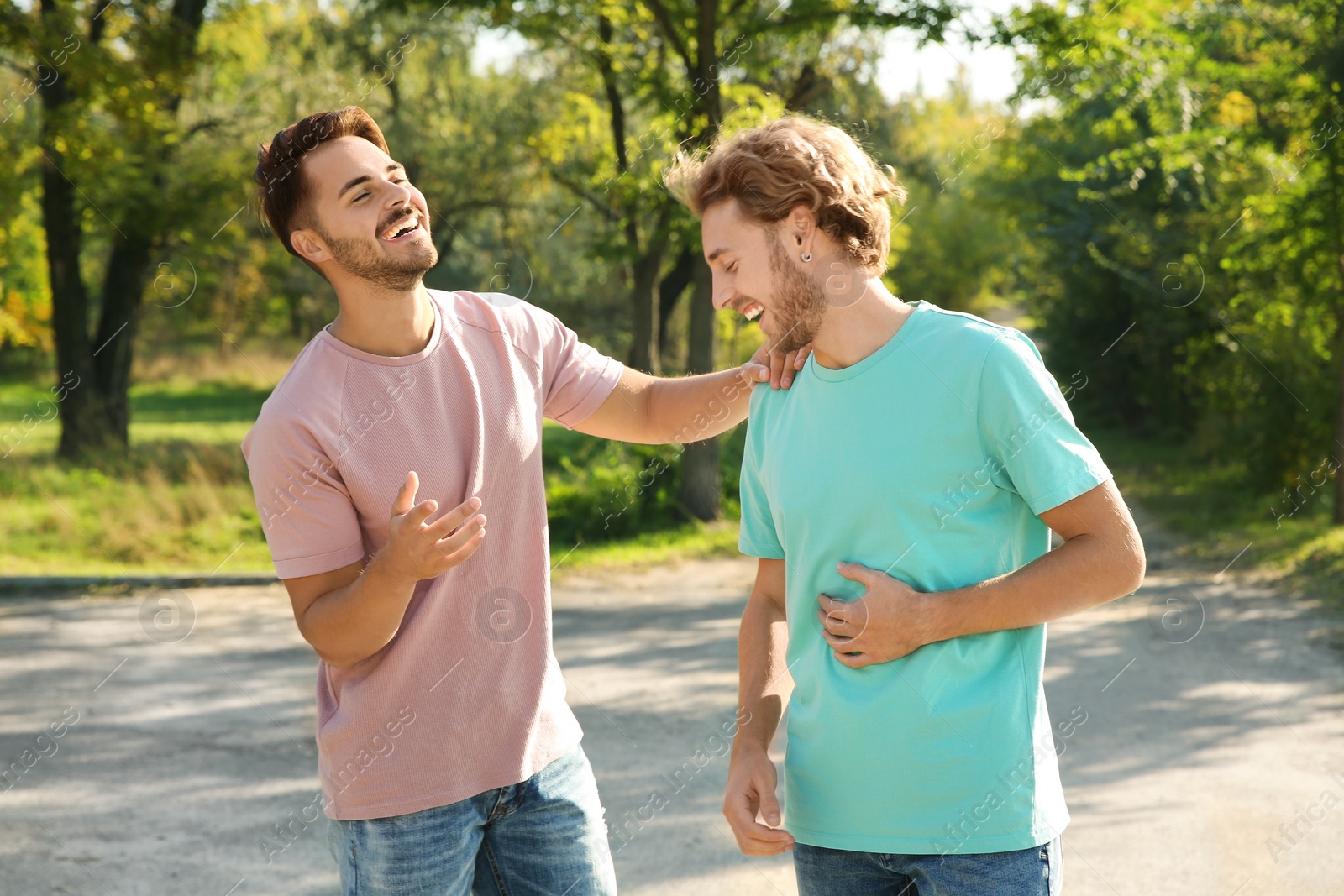 Photo of Happy gay couple having fun in park