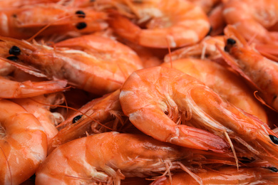 Photo of Pile of delicious cooked shrimps as background, closeup