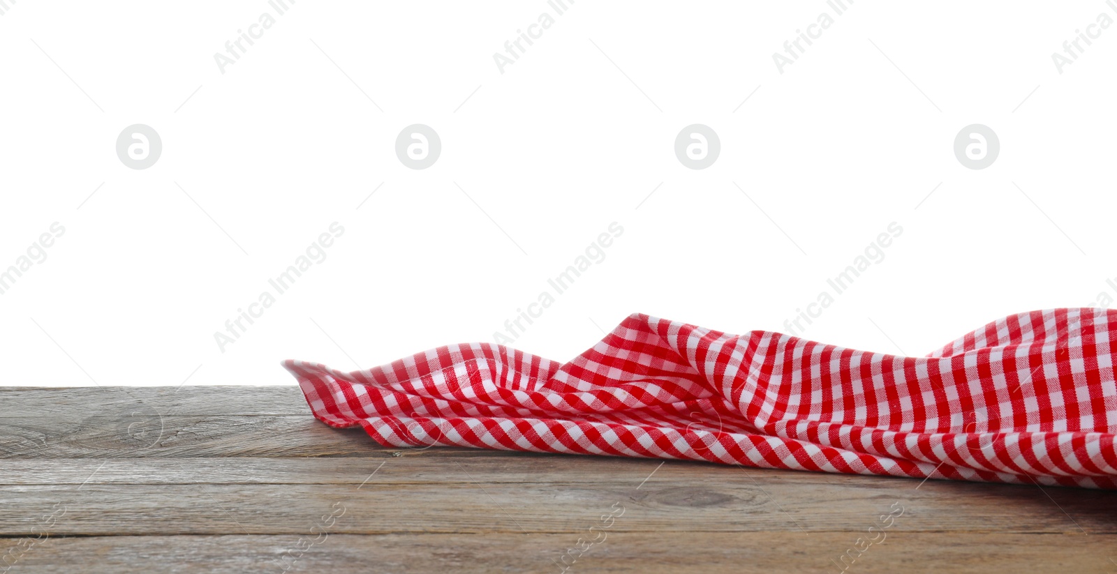 Photo of Red checkered cloth on wooden table against white background. Mockup for design