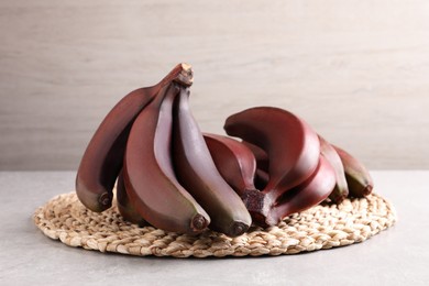 Delicious red baby bananas on light table