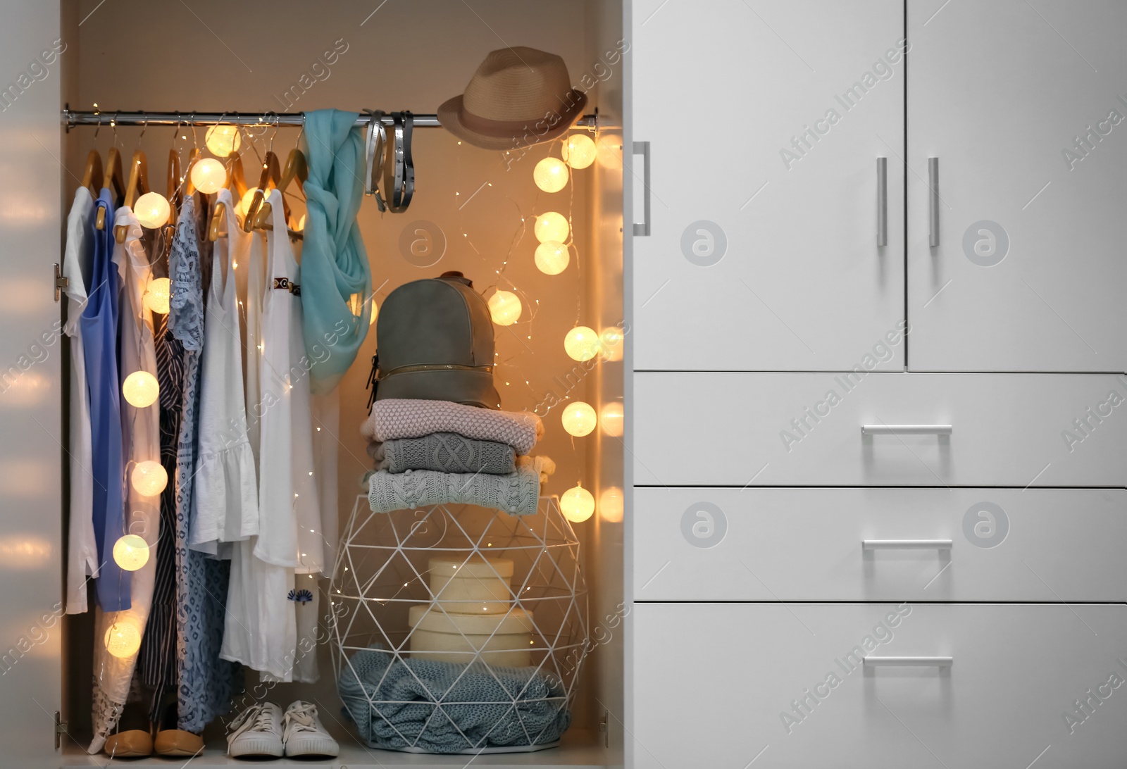 Photo of Women clothing on hangers in wardrobe