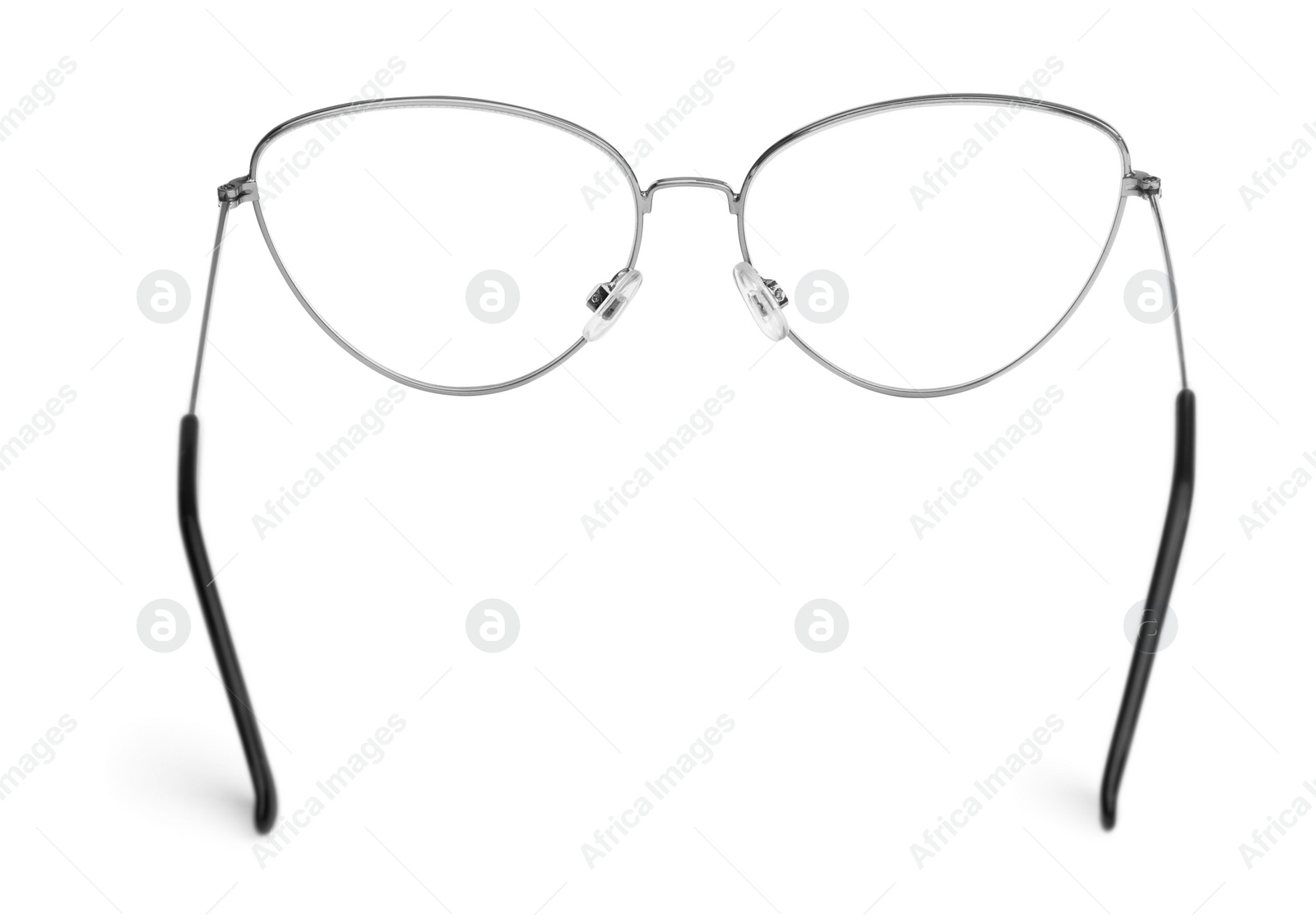 Photo of Stylish glasses with metal frame isolated on white