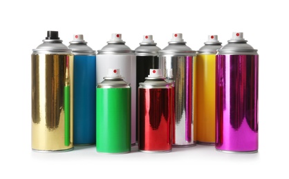 Photo of Different cans of spray paints on white background