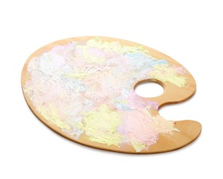 Photo of Wooden artist's palette with mixed pastel paints isolated on white