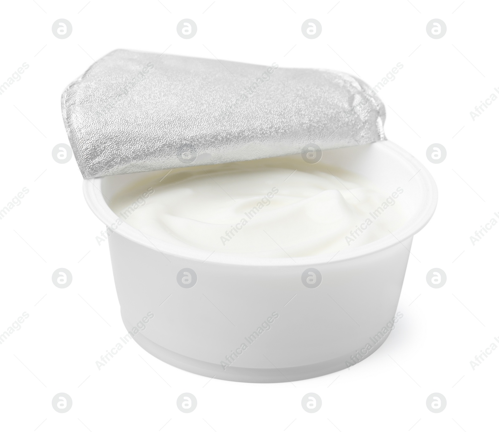 Photo of Delicious natural yogurt in plastic cup isolated on white