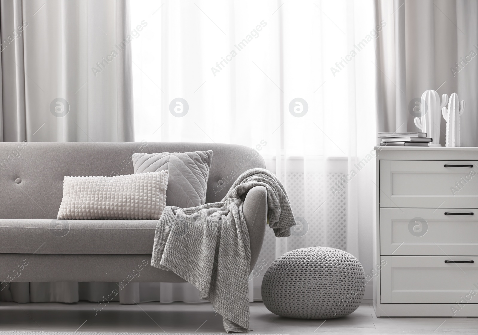 Photo of Beautiful curtains on window in stylish living room interior