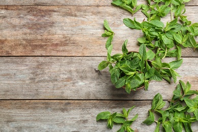 Photo of Flat lay composition with mint on wooden background