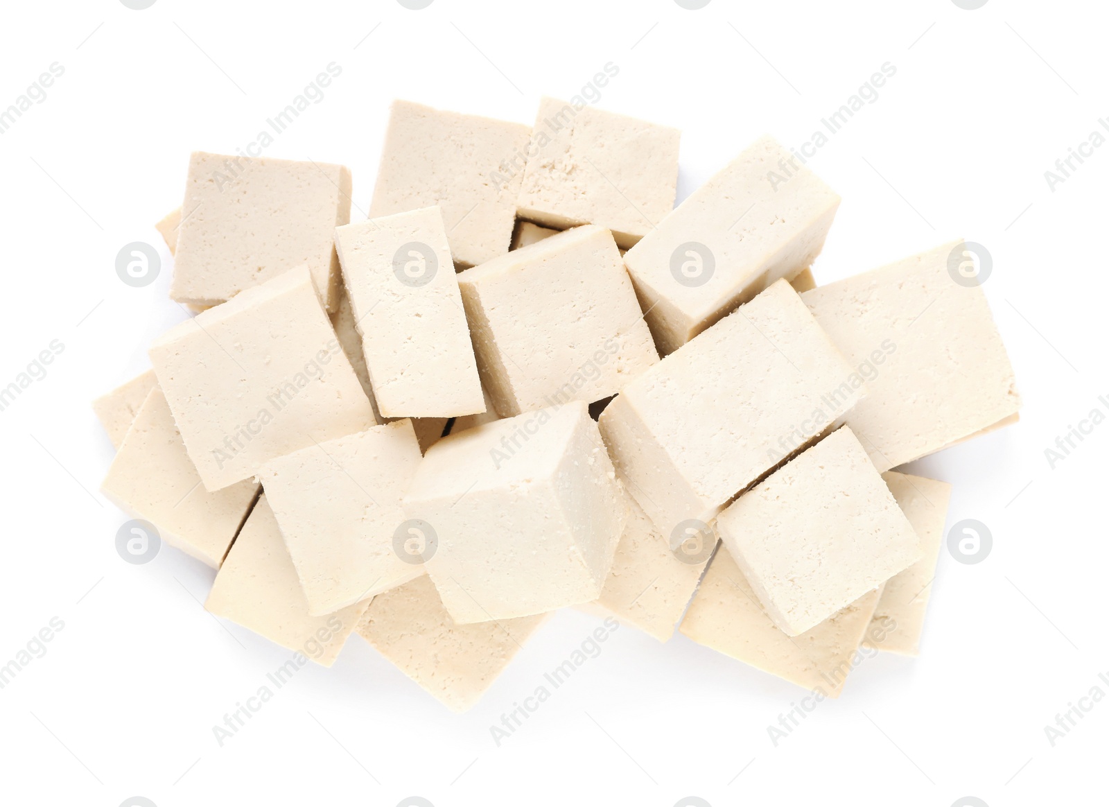 Photo of Delicious raw tofu pieces on white background, top view