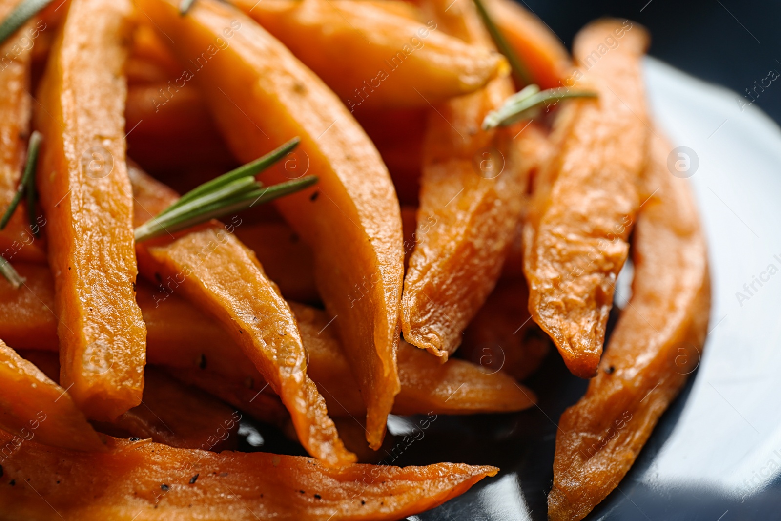 Photo of Closeup view of plate with tasty sweet potato fries