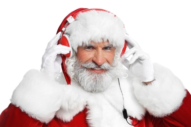 Photo of Santa Claus listening to Christmas music on white background