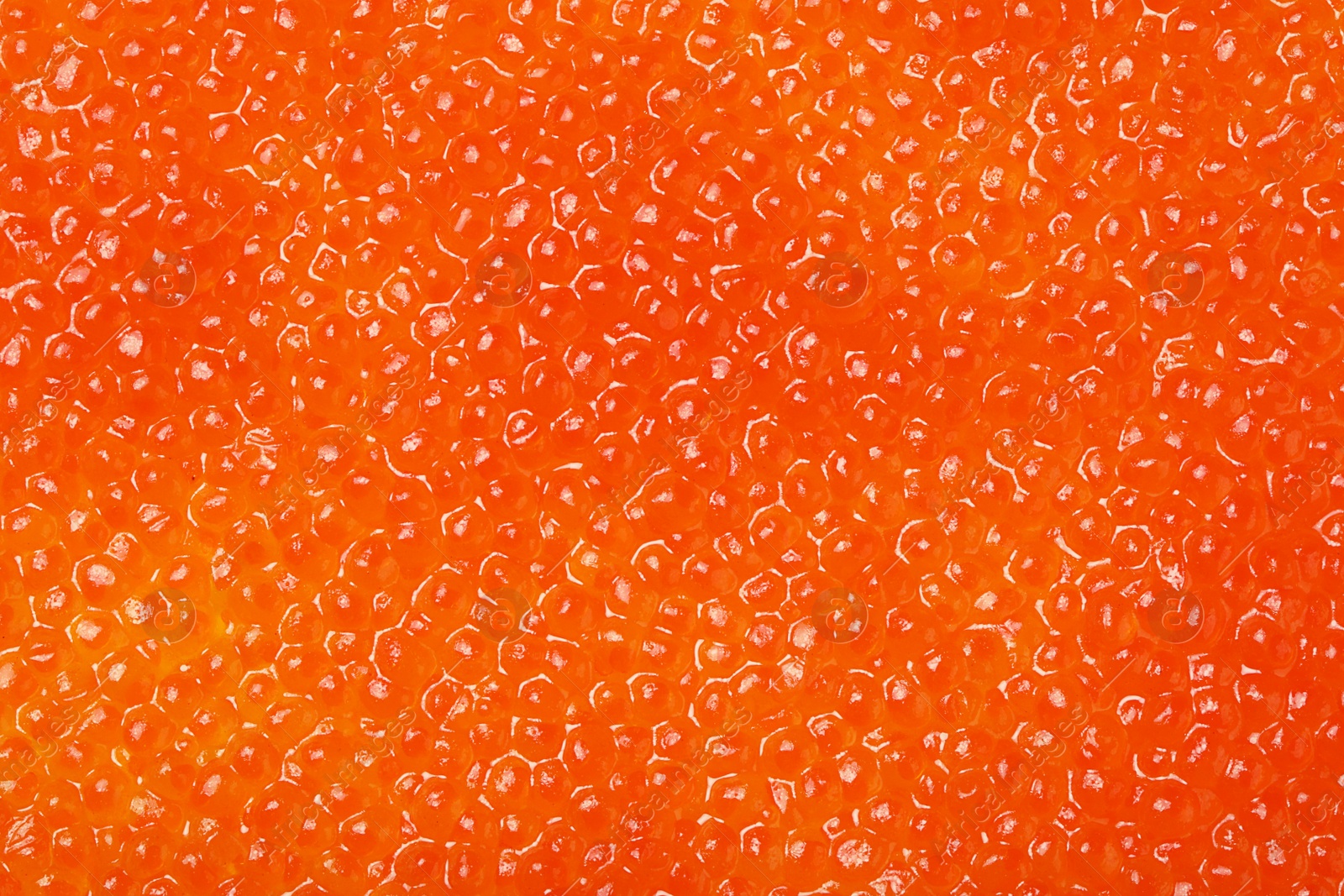 Photo of Delicious red caviar as background, top view