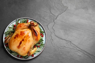 Delicious cooked turkey served on black table, top view with space for text. Thanksgiving Day celebration