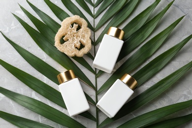 Flat lay composition with jars for cosmetic products on stone table. Spa supplies