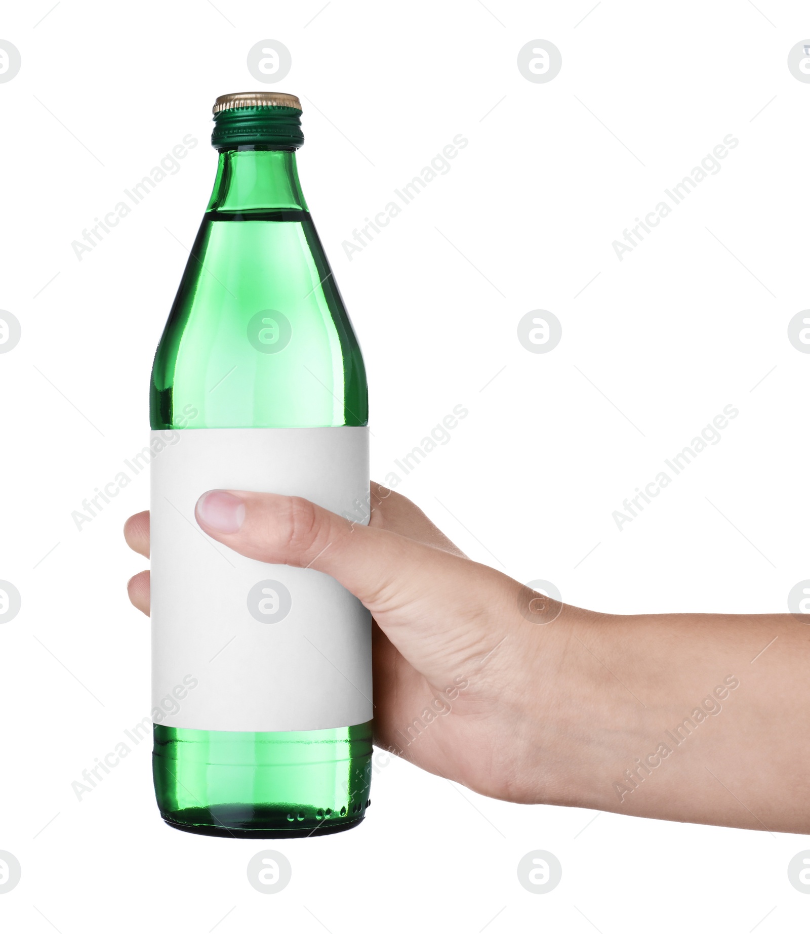 Photo of Woman holding glass bottle with soda water on white background, closeup