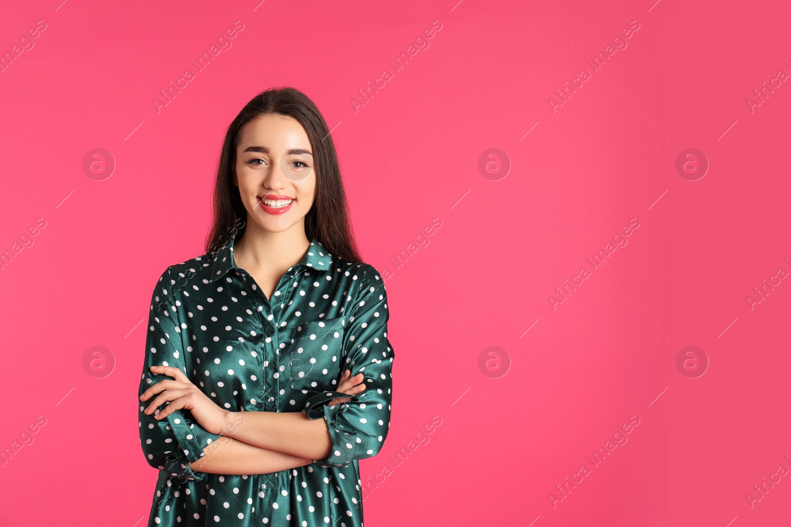 Photo of Portrait of beautiful young woman in stylish dress on color background. Space for text