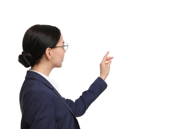 Young businesswoman in suit on white background