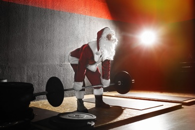 Young Santa Claus training in modern gym