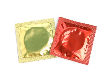 Photo of Condom packages on white background, top view. Safe sex