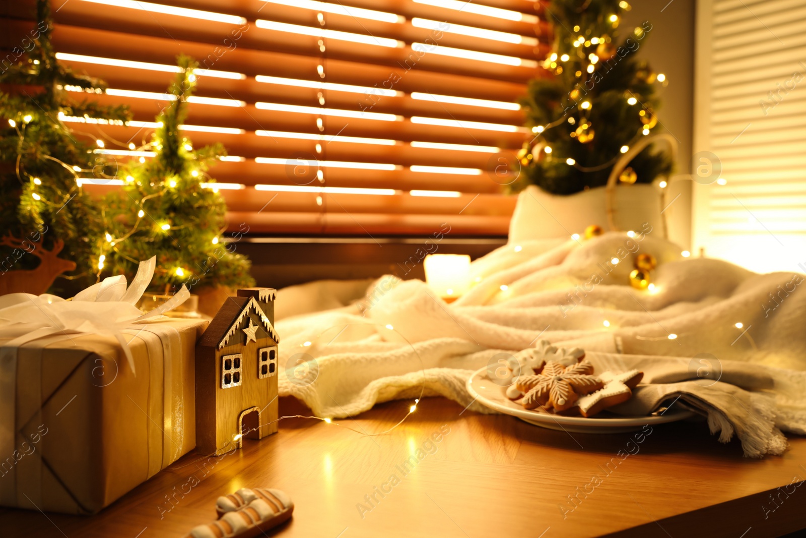 Photo of Beautiful Christmas decor and cookies on wooden window sill