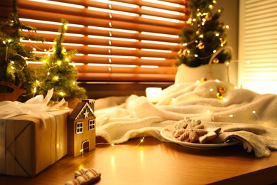 Beautiful Christmas decor and cookies on wooden window sill